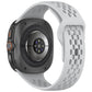 Light gray perforated silicone watch band attached to a smartwatch, shown from the back