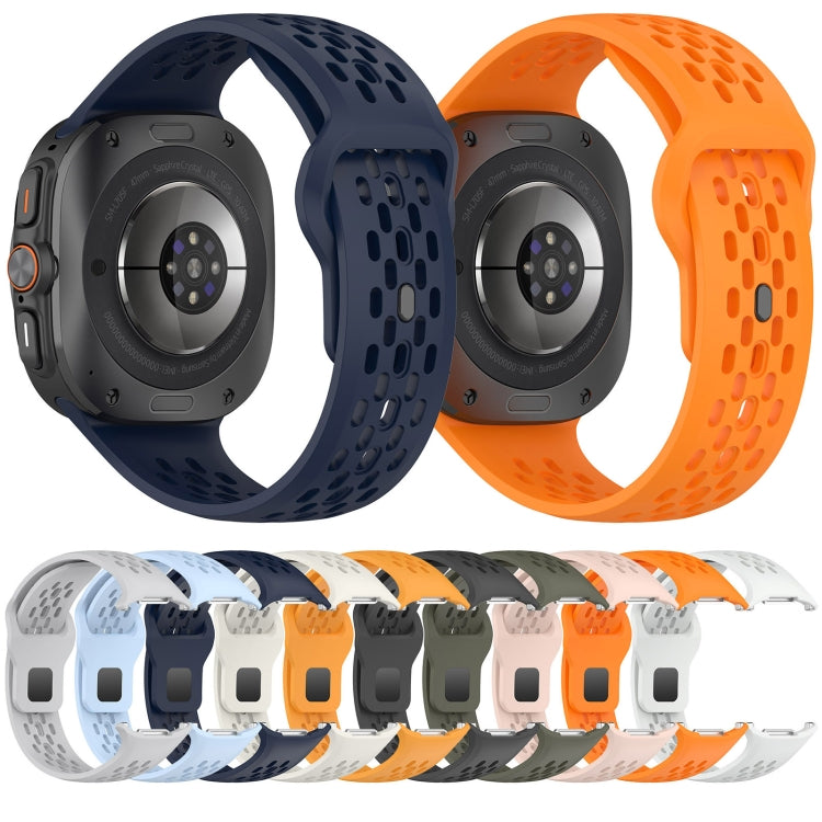 Perforated silicone watch bands in navy and orange, shown on the backs of watches.