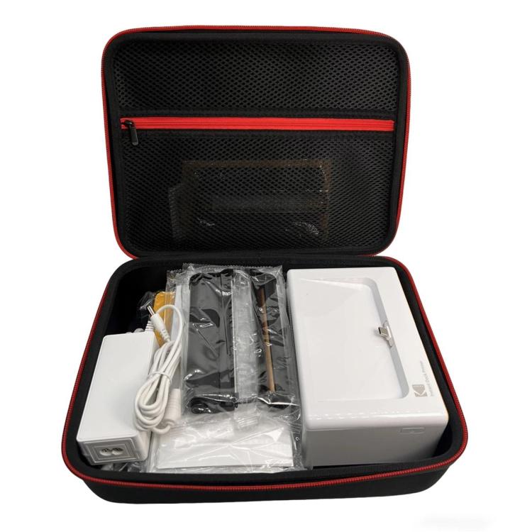 Hard storage case with molded top pocket and red-trim zipper, open with accessories