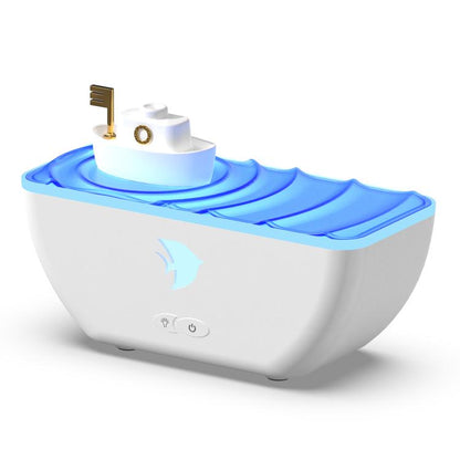 White boat-shaped ultrasonic humidifier aromatherapy diffuser with blue LED glow