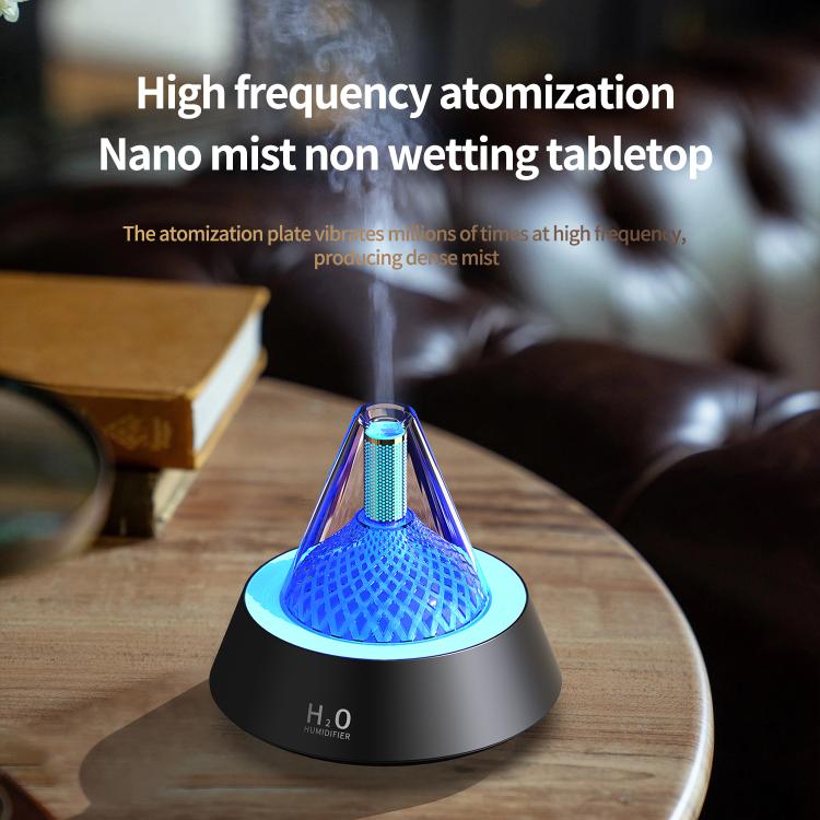 Glittering humidifier diffuser with blue light glow on a tabletop