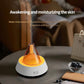 Glittering humidifier diffuser with orange light glow and white base