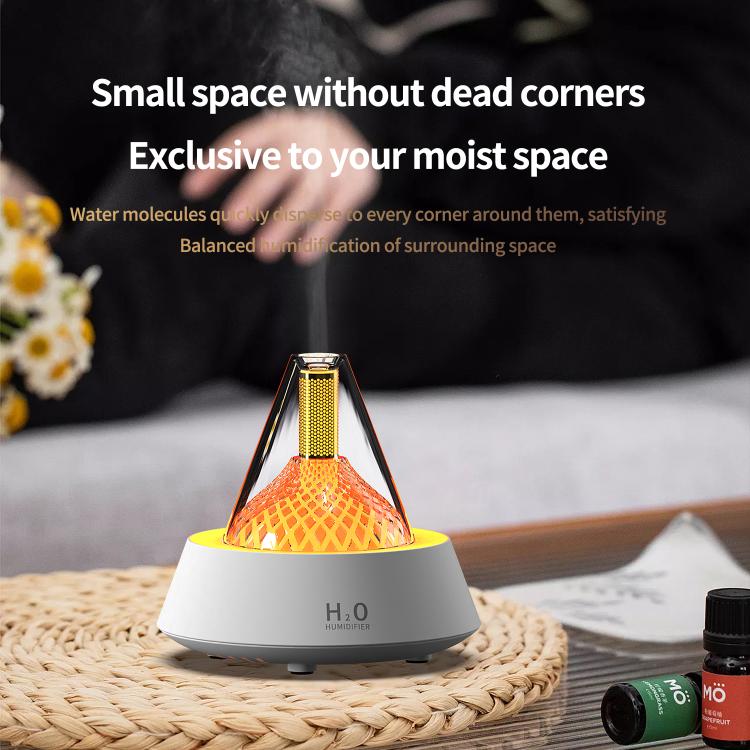 Glittering humidifier diffuser with orange light glow on a mat