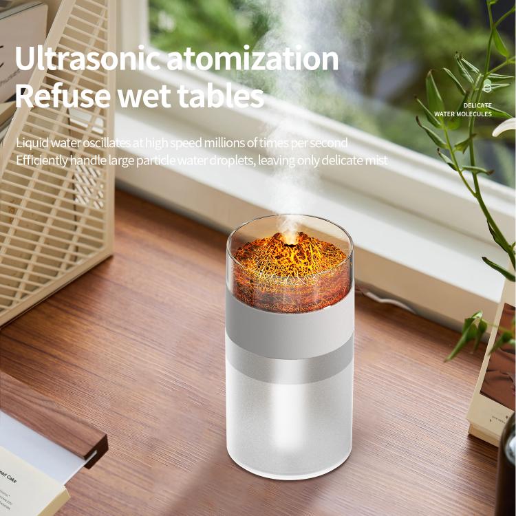White simulated volcano humidifier with orange glow and rising mist from top opening