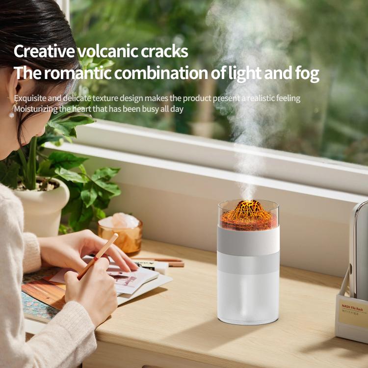 White simulated volcano humidifier releasing mist with orange glowing lava dome
