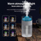 White simulated volcano humidifier with cool blue light and visible mist plume