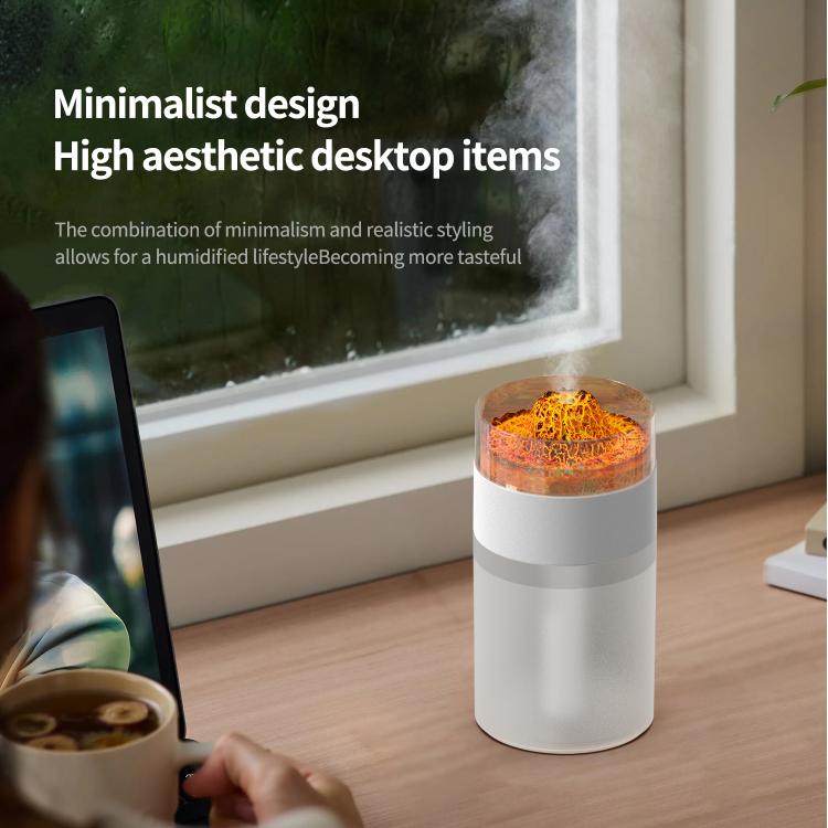 White simulated volcano humidifier with orange-lit dome by window, mist in air