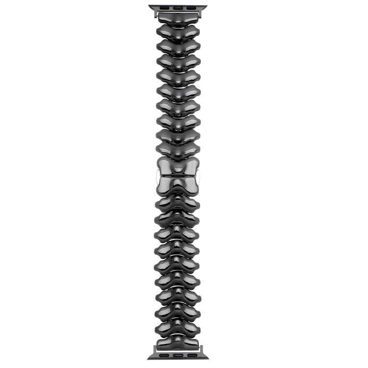 Dark gunmetal dragon spine metal watch band shown flat with linked segments and clasp
