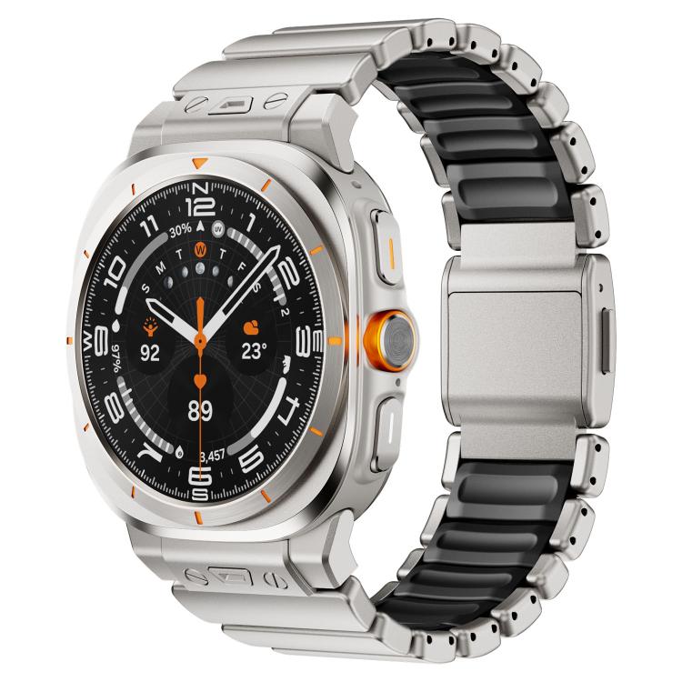 Silver smartwatch with a black silicone and stainless steel link band and magnetic clasp