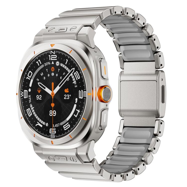 Watch band with gray silicone links and a silver magnetic clasp on a silver watch