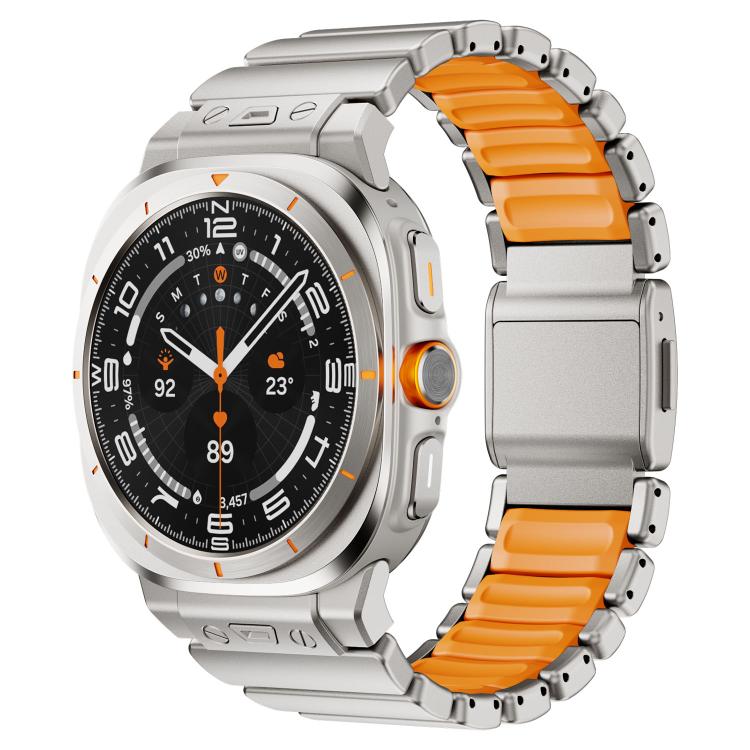 Watch band with orange silicone links and a silver magnetic clasp on a silver watch