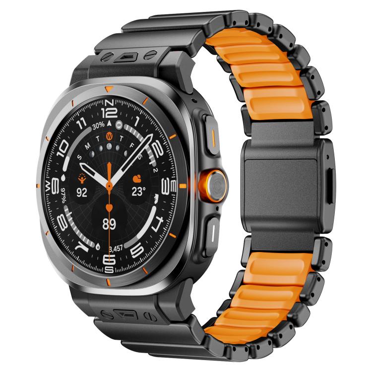 Black watch band with orange silicone links and a dark magnetic clasp