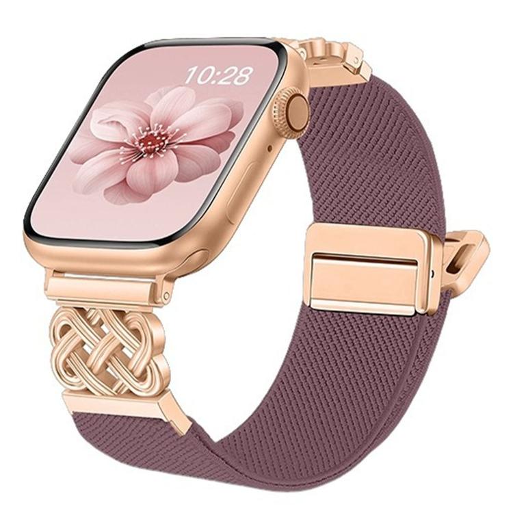 Apple Watch with a mauve woven stretch band, gold-tone Chinese knot connector and magnetic clasp
