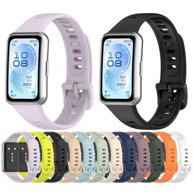 Silicone watch bands in assorted colors, including light purple and black, shown with a smartwatch.