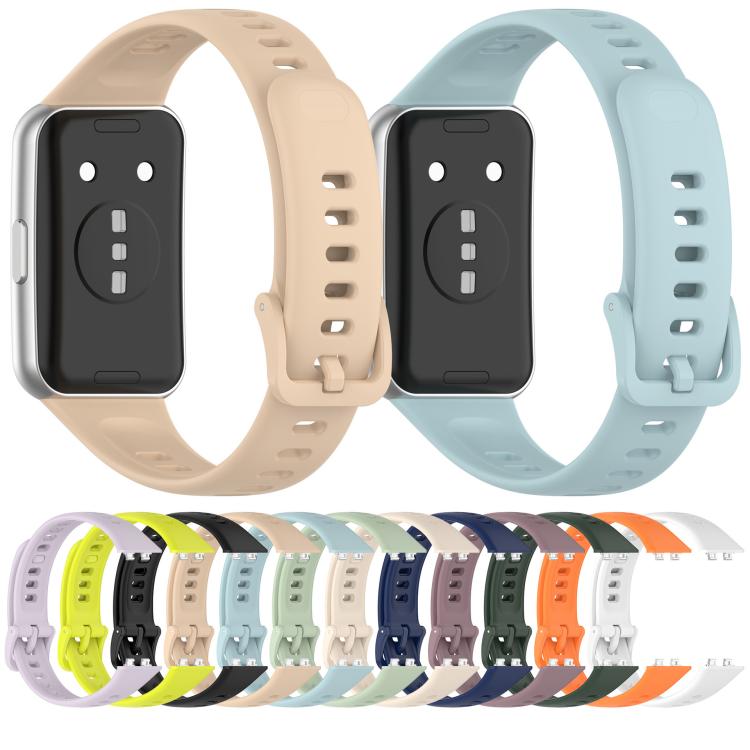 Glossy silicone watch bands in assorted colors, with adjustment holes and buckle closures