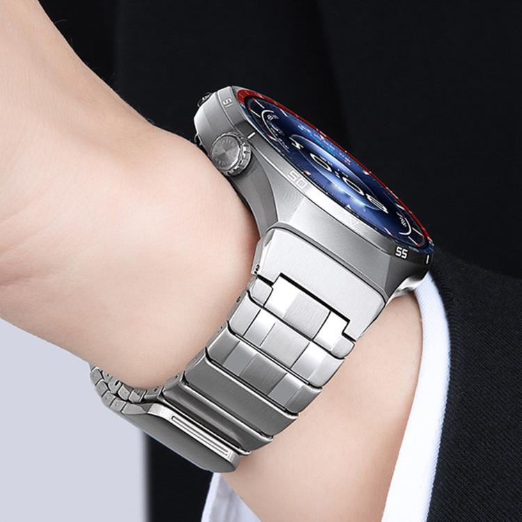 Silver stainless steel watch band fitted to a smartwatch on a wrist