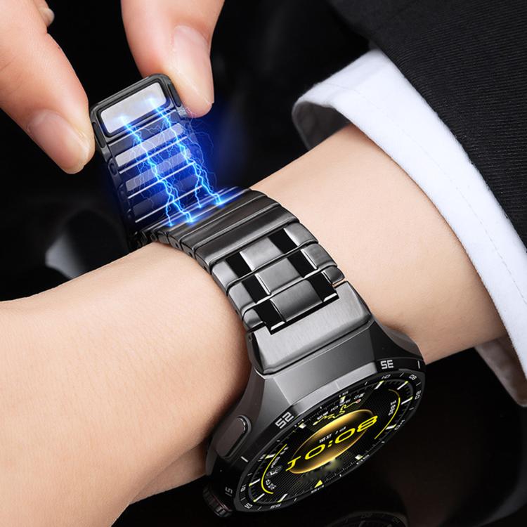 Black stainless steel magnetic watch band being fastened around a wrist