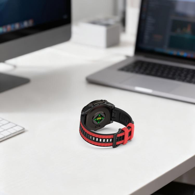 Black silicone watch band with red accents and a watch shown from the back.
