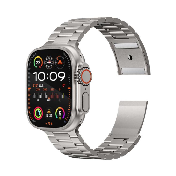 Silver metal watch band attached to a smartwatch, with three-bead links and magnetic clasp