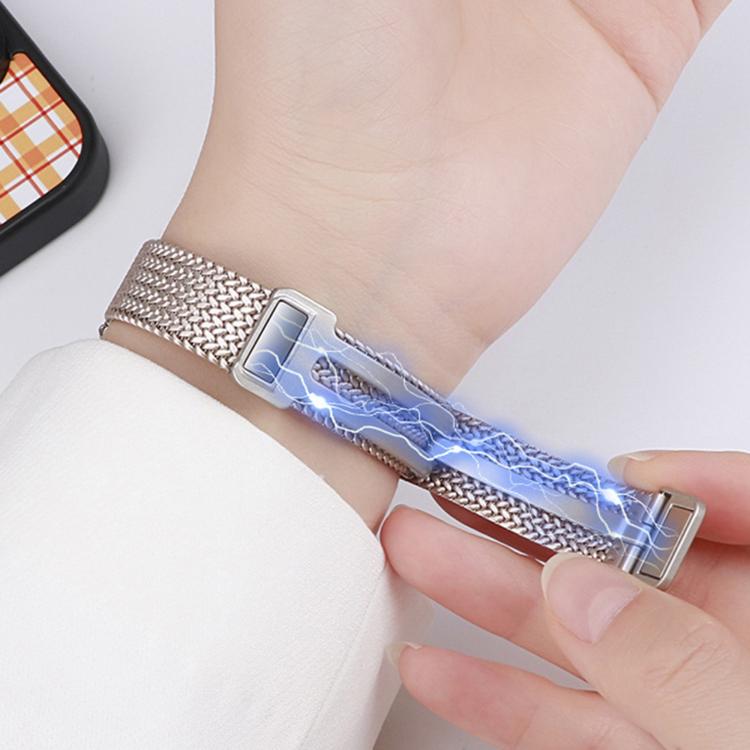 Silver stainless steel mesh watch band with magnetic fold clasp being opened