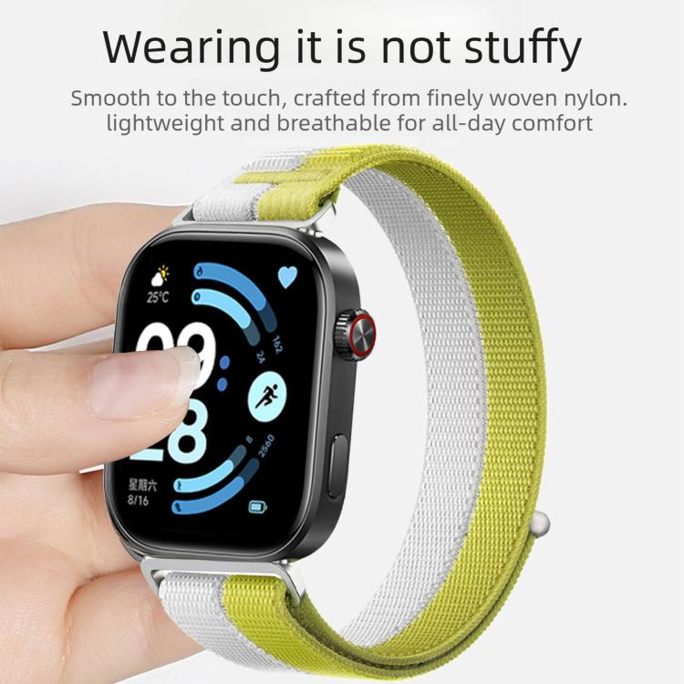 Lime green and white woven nylon loop watch band worn on a wrist