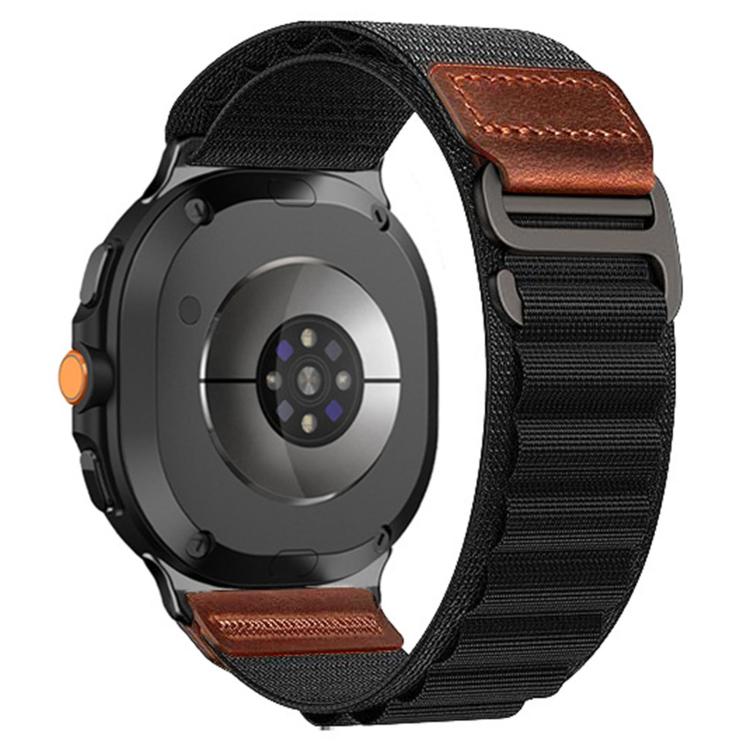 Black alpine nylon watch band with brown leather tabs attached to a black smartwatch