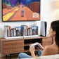 Universal disc holder on a TV stand with game cases beside a controller