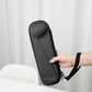 Black zippered hard case held by a hand with a shoulder strap