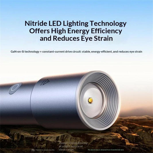 Silver-gray flashlight with wide front lens and centered LED in view