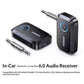 Bluetooth audio receiver with 3.5mm AUX jacks and blue-lit button, black and silver