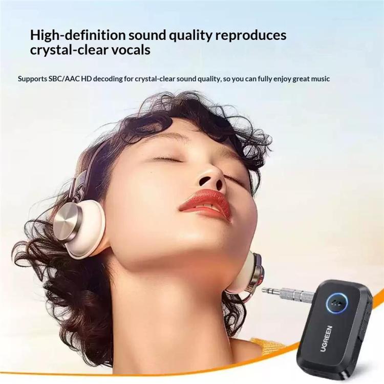 Portable Bluetooth audio receiver adapter, black with blue button and 3.5mm AUX cable
