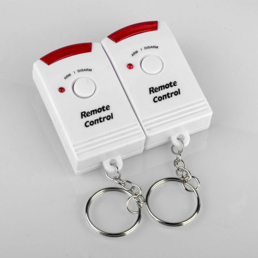 Remote control alarm key fobs with red and green indicator lights and circular buttons
