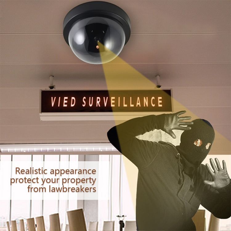 Ceiling-mounted black dome security camera with visible red LED