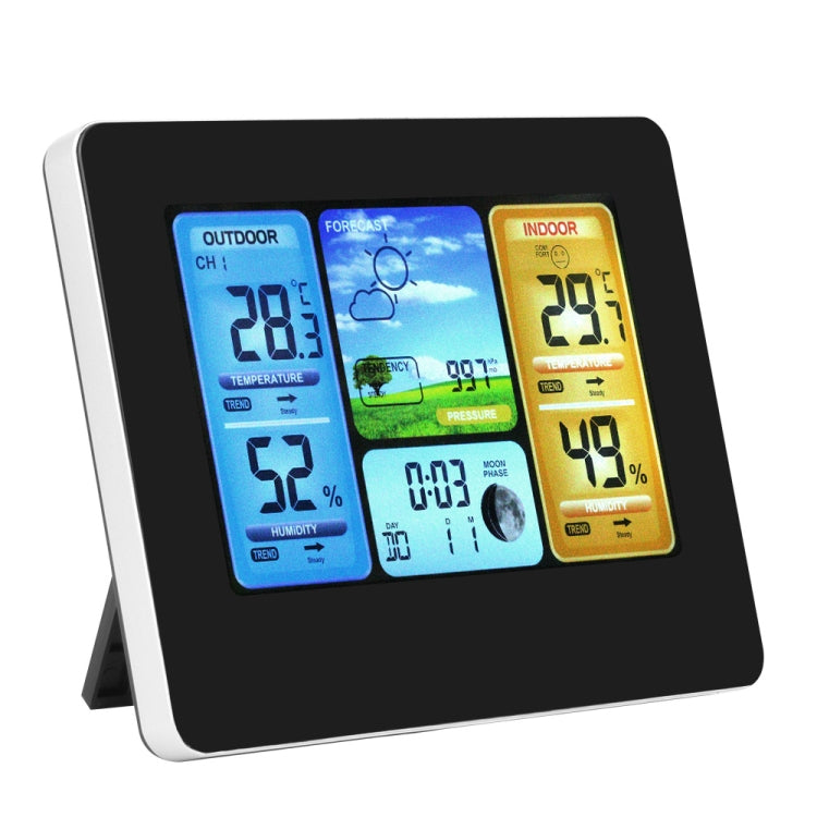 Wireless weather station with tilted color display showing outdoor and indoor temperature and humidity