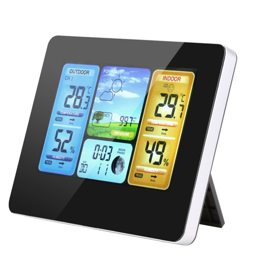 Wireless weather station front view with blue indoor/outdoor panels and barometer forecast graphics