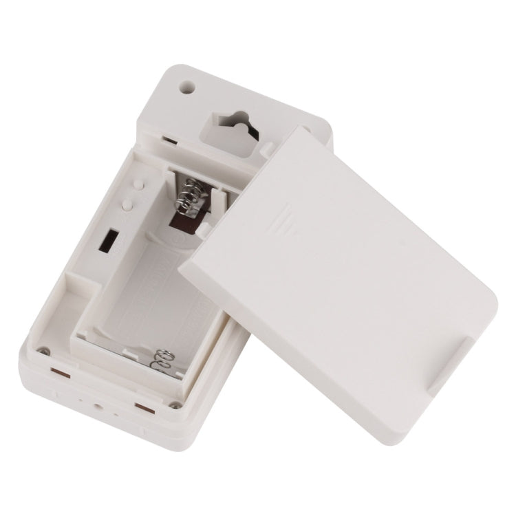 Wireless outdoor sensor open battery compartment and mounting slot in white housing