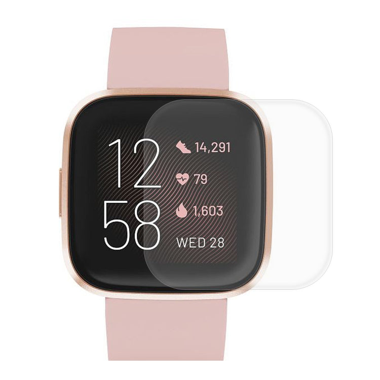 Full-coverage TPU screen protector film on Fitbit smartwatch display, transparent overlay
