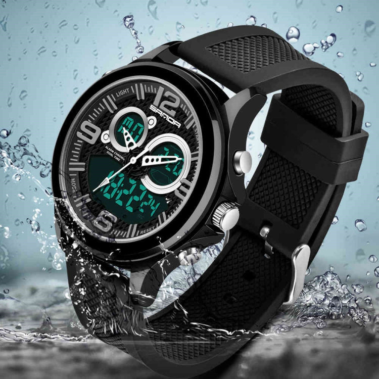 Digital wristwatch with black case, green luminous dial, black strap with buckle