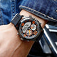 Digital wristwatch on wrist with black case, orange-accent dial, black strap