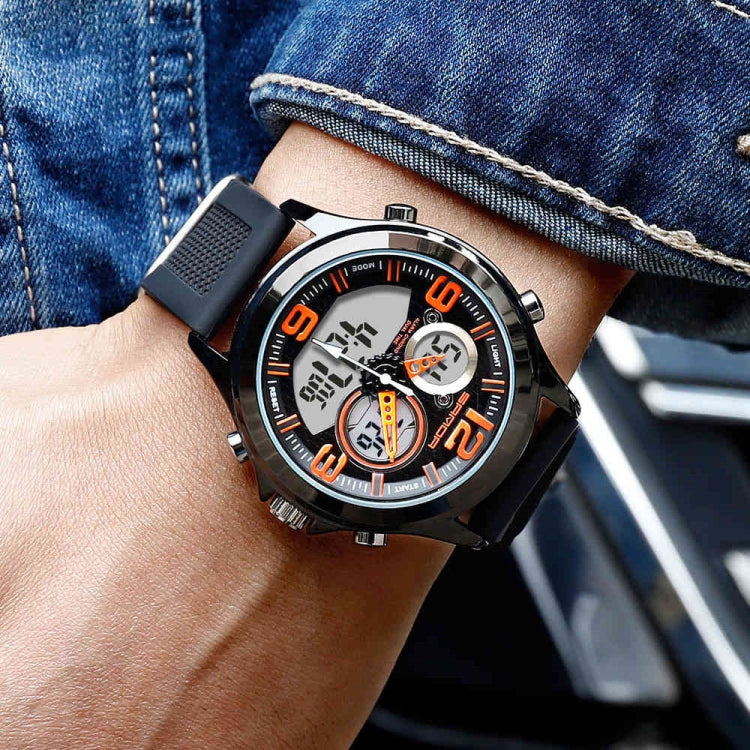 Digital wristwatch on wrist with black case, orange-accent dial, black strap