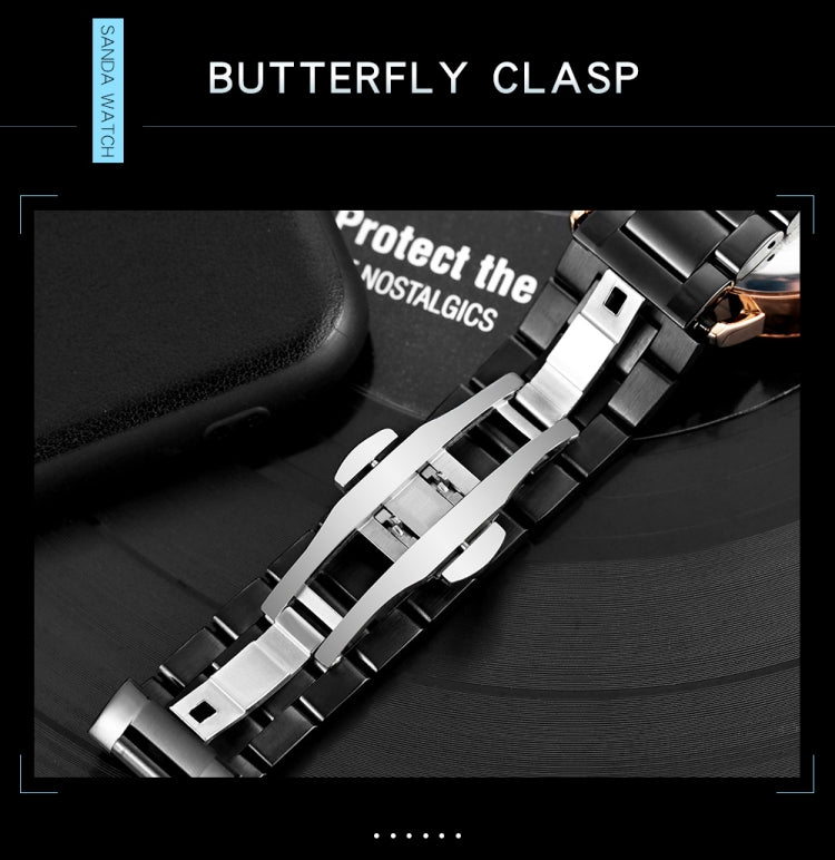 Watch clasp and band connection detail with metal links and buckle hardware