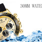 Gold-tone quartz wristwatch with black silicone strap, multi-dial beige face