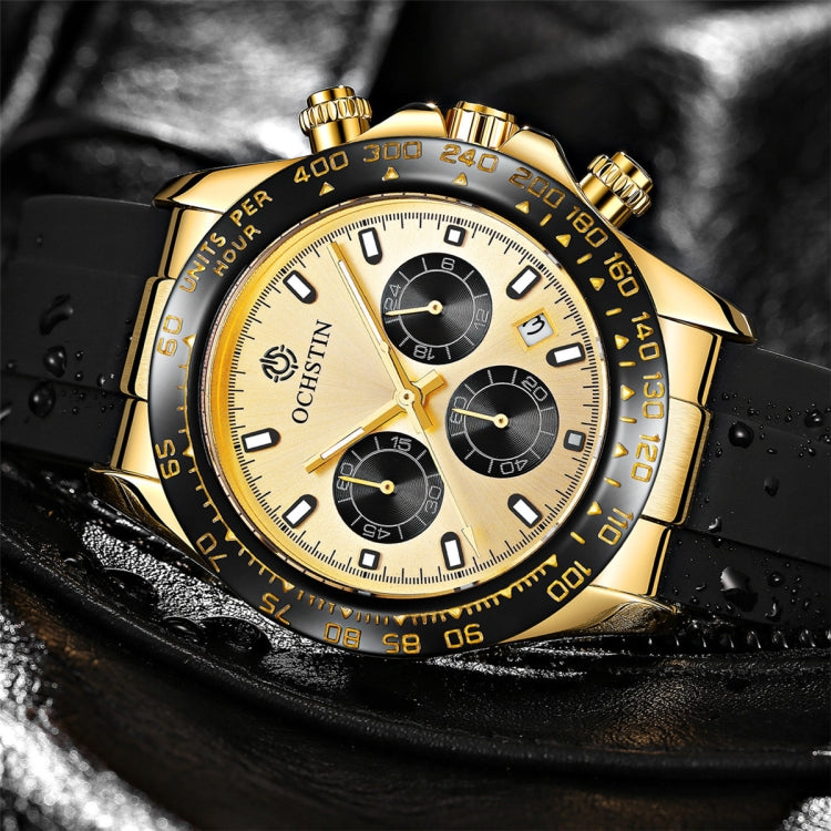 Gold-tone quartz chronograph on black strap with water droplets, white dial and subdials