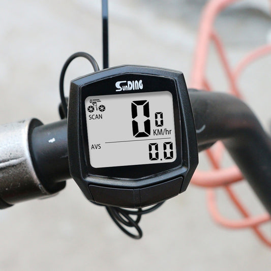 Bike wired speedometer computer on handlebar, black LCD showing 18 km/h and 0.0