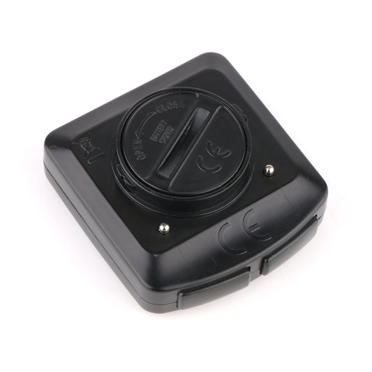 Wired bicycle computer back with battery dial, screws, and round sensor mount area
