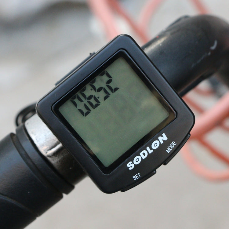Wired waterproof bicycle computer with green LCD mounted on handlebars, SDLON branding