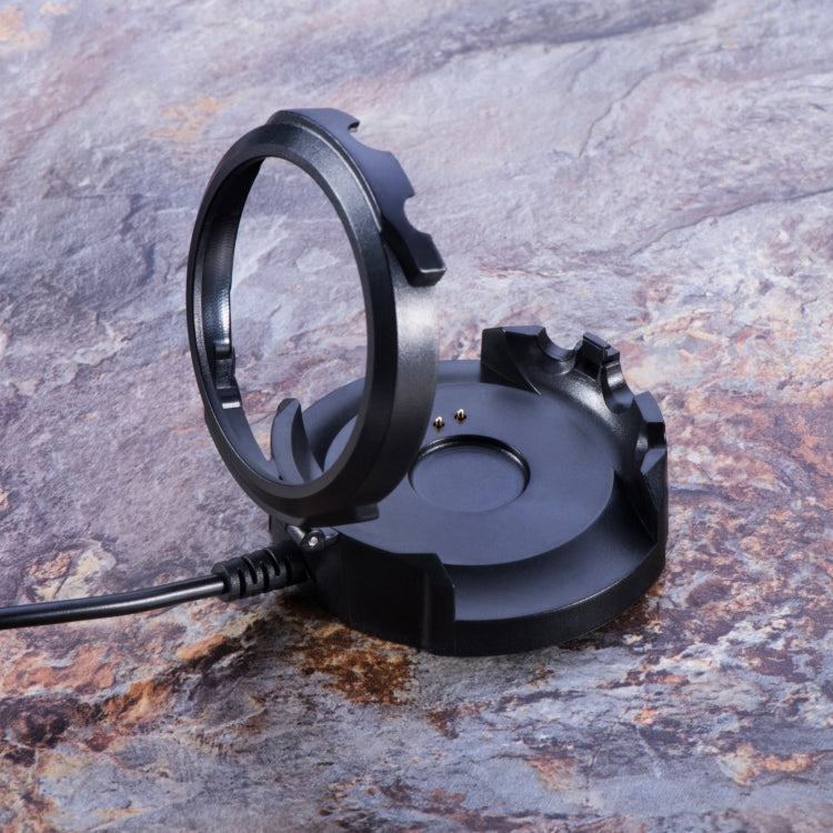 Black charging dock with open ring cradle and cable connected