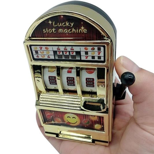 Mini slot machine toy stress reliever in gold color with smile face window and lever