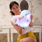 White heart-shaped plush glow pillow with red 'I love You' text and small button