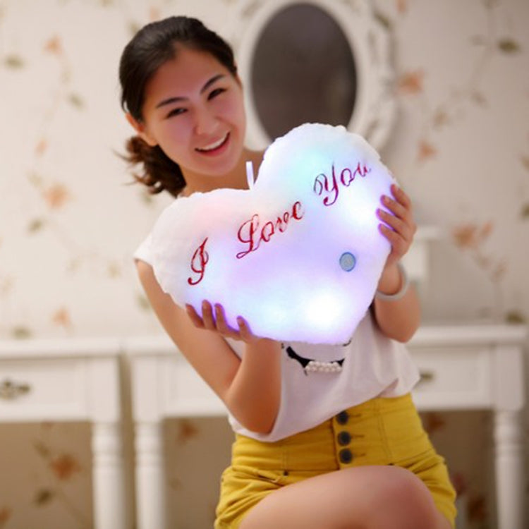 White heart-shaped plush glow pillow with red 'I love You' text and small button
